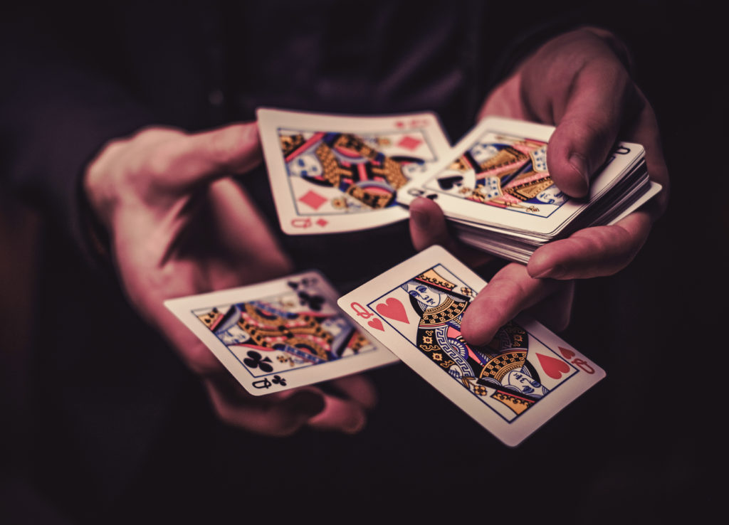 man showing tricks with cards